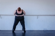 Carol Squires warming up before a rehearsal  session of the Phat Fly Girls, a hip hop performing ensemble featuring fat dancers. The  Phat Fly Girls shows are produced by Big Moves, the only service organization in the world dedicated to promoting size diversity in dance.
