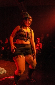 Heather MacAllister, better known as Ms. DeMeanor,  during the Fat-Bottom Revue, a burlesque show featuring fat artists in a mixture of classic stripper-jazz numbers and erotic comedy. The show is produced by Big Moves, a San Francisco Bay Area organization that promotes size diversity in the dance world.