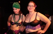 Heather MacAllister, better known as Ms. DeMeanor,  (L) and Marina Wolf at the end of the Fat-Bottom Revue, a burlesque show featuring fat artists in a mixture of classic stripper-jazz numbers and erotic comedy. The show is produced by Big Moves, a San Francisco Bay Area organization that promotes size diversity in the dance world.
