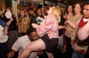 A party goer gobbling a jello portion made withTequila. Patrons of all sizes enjoy dancing and partying at the Big Boogie Nights, a nightclub event opened to all fat people who do not feel confortable going to regular nightclubs. Big Boogie Nights describe itself as \"where the big beautiful people love to party\".