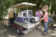 Adoption counselor Amanda Bristow (R) and founder Lynea Lattanzio loading a cart with cages of young cats ready to be taken to the veterinarian at The Cat House on the Kings in Parlier, CA, on May 10, 2012.  The Cat House on The Kings is a sanctuary for cats that was started by Lynea Lattanzio in her own house. There are now over 700 cats on the 12-acre property.