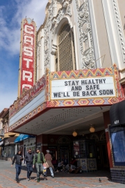 Pedestrians walk past the Castro Theater on Castro Street in San Francisco, California, U.S., on  March 18, 2020.
Millions of San Francisco Bay Area  residents were ordered to stay home to slow the spread of the coronavirus as part of a lockdown effort, marking one of the nation's strongest efforts to stem the spread of the deadly virus.