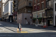 A man stands in the middle of the street in downtown San Francisco, CA, on March 20, 2020, All the retail stores are closed following an order from the governor. 
California residents were ordered to stay home to slow the spread of the coronavirus as part of a lockdown effort.