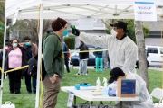 A Paramedic checks the temperature of man at a first-of-its-kind COVID-19 testing center in Hayward, CA, on March 23, 2020.  If the fever is above 100.4 degrees Fahrenheit, they will be tested for the coronavirus. 
The free test facility opened to  to the public this morning regardless of where the patients live or their immigration status. 
The entire state of California is on a shelter-in-place status ordered by the governor to slow the spread of the COVID-19 disease.