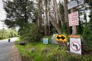 Signs at the entrance to the reclusive town of Bolinas, CA, on April 20, 2020, ask visitors to stay away because of the coronavirus pandemic.