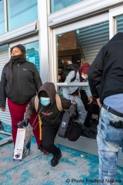 Looters stealing goods after they broke into the local Best Buy store in Emeryville , CA, on May 30, 2020.