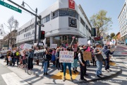 Demonstrators gather outside the Tesla dealership in San Francisco, CA, on March 29, 2025, as part of the global "Tesla Takedown" protests. These protests, spanning over 200 locations worldwide, were organized to oppose Elon Musk's involvement with the U.S. federal government and the associated budget cuts and layoffs. The protesters held signs and chanted slogans to express their discontent with Musk's actions. The movement encourages individuals to boycott Tesla products and divest from Tesla stock, aiming to impact the company's financial standing as a form of protest.
