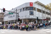 Demonstrators gather outside the Tesla dealership in San Francisco, CA, on March 29, 2025, as part of the global "Tesla Takedown" protests. These protests, spanning over 200 locations worldwide, were organized to oppose Elon Musk's involvement with the U.S. federal government and the associated budget cuts and layoffs. The protesters held signs and chanted slogans to express their discontent with Musk's actions. The movement encourages individuals to boycott Tesla products and divest from Tesla stock, aiming to impact the company's financial standing as a form of protest.