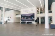 Demonstrators gather outside the Tesla dealership in San Francisco, CA, on March 29, 2025, as part of the global "Tesla Takedown" protests. These protests, spanning over 200 locations worldwide, were organized to oppose Elon Musk's involvement with the U.S. federal government and the associated budget cuts and layoffs. The protesters held signs and chanted slogans to express their discontent with Musk's actions. The movement encourages individuals to boycott Tesla products and divest from Tesla stock, aiming to impact the company's financial standing as a form of protest.