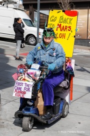 Demonstrators gather outside the Tesla dealership in San Francisco, CA, on March 29, 2025, as part of the global "Tesla Takedown" protests. These protests, spanning over 200 locations worldwide, were organized to oppose Elon Musk's involvement with the U.S. federal government and the associated budget cuts and layoffs. The protesters held signs and chanted slogans to express their discontent with Musk's actions. The movement encourages individuals to boycott Tesla products and divest from Tesla stock, aiming to impact the company's financial standing as a form of protest.