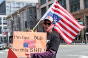 Demonstrators gather outside the Tesla dealership in San Francisco, CA, on March 29, 2025, as part of the global "Tesla Takedown" protests. These protests, spanning over 200 locations worldwide, were organized to oppose Elon Musk's involvement with the U.S. federal government and the associated budget cuts and layoffs. The protesters held signs and chanted slogans to express their discontent with Musk's actions. The movement encourages individuals to boycott Tesla products and divest from Tesla stock, aiming to impact the company's financial standing as a form of protest.