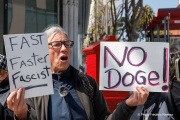 Demonstrators gather outside the Tesla dealership in San Francisco, CA, on March 29, 2025, as part of the global "Tesla Takedown" protests. These protests, spanning over 200 locations worldwide, were organized to oppose Elon Musk's involvement with the U.S. federal government and the associated budget cuts and layoffs. The protesters held signs and chanted slogans to express their discontent with Musk's actions. The movement encourages individuals to boycott Tesla products and divest from Tesla stock, aiming to impact the company's financial standing as a form of protest.