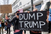 Demonstrators gather outside the Tesla dealership in San Francisco, CA, on March 29, 2025, as part of the global "Tesla Takedown" protests. These protests, spanning over 200 locations worldwide, were organized to oppose Elon Musk's involvement with the U.S. federal government and the associated budget cuts and layoffs. The protesters held signs and chanted slogans to express their discontent with Musk's actions. The movement encourages individuals to boycott Tesla products and divest from Tesla stock, aiming to impact the company's financial standing as a form of protest.