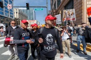 Supporters of Elon Musk's Department of Government Efficiency (DOGE) engage with demonstrators that gathered outside the Tesla dealership in San Francisco, CA, on March 29, 2025, as part of the global "Tesla Takedown" protests. These protests, spanning over 200 locations worldwide, were organized to oppose Elon Musk's involvement with the U.S. federal government and the associated budget cuts and layoffs. The protesters held signs and chanted slogans to express their discontent with Musk's actions. The movement encourages individuals to boycott Tesla products and divest from Tesla stock, aiming to impact the company's financial standing as a form of protest.