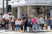 Demonstrators gather outside the Tesla dealership in San Francisco, CA, on March 29, 2025, as part of the global "Tesla Takedown" protests. These protests, spanning over 200 locations worldwide, were organized to oppose Elon Musk's involvement with the U.S. federal government and the associated budget cuts and layoffs. The protesters held signs and chanted slogans to express their discontent with Musk's actions. The movement encourages individuals to boycott Tesla products and divest from Tesla stock, aiming to impact the company's financial standing as a form of protest.