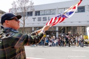 Demonstrators gather outside the Tesla dealership in San Francisco, CA, on March 29, 2025, as part of the global "Tesla Takedown" protests. These protests, spanning over 200 locations worldwide, were organized to oppose Elon Musk's involvement with the U.S. federal government and the associated budget cuts and layoffs. The protesters held signs and chanted slogans to express their discontent with Musk's actions. The movement encourages individuals to boycott Tesla products and divest from Tesla stock, aiming to impact the company's financial standing as a form of protest.