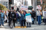 Demonstrators gather outside the Tesla dealership in San Francisco, CA, on March 29, 2025, as part of the global "Tesla Takedown" protests. These protests, spanning over 200 locations worldwide, were organized to oppose Elon Musk's involvement with the U.S. federal government and the associated budget cuts and layoffs. The protesters held signs and chanted slogans to express their discontent with Musk's actions. The movement encourages individuals to boycott Tesla products and divest from Tesla stock, aiming to impact the company's financial standing as a form of protest.
