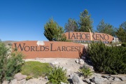Signs at the entrance to the Tahoe Reno Industrial Center (TRIC), one of the largest industrial parks in the world, in Sparks, NV. TRIC has become one of the densest concentrations of hyperscale data center infrastructure in the western United States. Its growth has been driven by favorable power costs, fast network connectivity to the Bay Area, and Nevada’s business friendly tax environment.