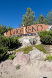Signs at the entrance to the Tahoe Reno Industrial Center (TRIC), one of the largest industrial parks in the world, in Sparks, NV. TRIC has become one of the densest concentrations of hyperscale data center infrastructure in the western United States. Its growth has been driven by favorable power costs, fast network connectivity to the Bay Area, and Nevada’s business friendly tax environment.