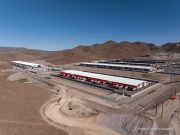 The Switch data center campus at the Tahoe Reno Industrial Center (TRIC), east of Sparks, NV, is one of the largest data center developments in the world and a defining symbol of the hyperscale infrastructure transforming northern Nevada into a major technology hub. Known for its massive, highly secure facilities, Switch built the campus to support cloud computing, enterprise data storage, and artificial intelligence workloads for large corporate clients. The company was drawn to TRIC by Nevada’s favorable tax structure, available land, access to renewable energy, and fast fiber connections to the Bay Area. The campus also uses an advanced cooling system designed for the desert climate, relying heavily on outside air and evaporative cooling technologies to reduce energy consumption while maintaining stable temperatures for thousands of servers operating around the clock. Surrounded by desert landscapes and heavy industrial development, the sprawling campus reflects the enormous physical footprint and energy demands of the digital economy powering modern internet and AI services.