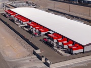 The cooling system of the Switch data center campus at the Tahoe Reno Industrial Center (TRIC), east of Sparks, NV. Swtich is one of the largest data center developments in the world and a defining symbol of the hyperscale infrastructure transforming northern Nevada into a major technology hub. Known for its massive, highly secure facilities, Switch built the campus to support cloud computing, enterprise data storage, and artificial intelligence workloads for large corporate clients. The company was drawn to TRIC by Nevada’s favorable tax structure, available land, access to renewable energy, and fast fiber connections to the Bay Area. The campus also uses an advanced cooling system designed for the desert climate, relying heavily on outside air and evaporative cooling technologies to reduce energy consumption while maintaining stable temperatures for thousands of servers operating around the clock. Surrounded by desert landscapes and heavy industrial development, the sprawling campus reflects the enormous physical footprint and energy demands of the digital economy powering modern internet and AI services.