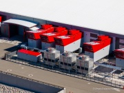 The cooling system of the Switch data center campus at the Tahoe Reno Industrial Center (TRIC), east of Sparks, NV. Swtich is one of the largest data center developments in the world and a defining symbol of the hyperscale infrastructure transforming northern Nevada into a major technology hub. Known for its massive, highly secure facilities, Switch built the campus to support cloud computing, enterprise data storage, and artificial intelligence workloads for large corporate clients. The company was drawn to TRIC by Nevada’s favorable tax structure, available land, access to renewable energy, and fast fiber connections to the Bay Area. The campus also uses an advanced cooling system designed for the desert climate, relying heavily on outside air and evaporative cooling technologies to reduce energy consumption while maintaining stable temperatures for thousands of servers operating around the clock. Surrounded by desert landscapes and heavy industrial development, the sprawling campus reflects the enormous physical footprint and energy demands of the digital economy powering modern internet and AI services.