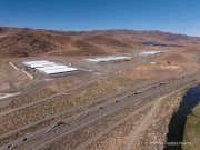 The Apple Reno Data Center with the Truckee river in the foreground near Sparks, in the Tahoe Reno Industrial Center (TRIC) east of Reno, NV.  
Apple operates there one of its major data center campuses. Opened in 2012, the facility supports services such as iCloud and other online infrastructure. The site was strategically chosen for Nevada’s dry climate, which allows the servers to be cooled efficiently using outside air for much of the year. Apple has also invested heavily in renewable energy projects in the region, including large solar installations that help power the campus. 
The Sparks data center has become an important part of Northern Nevada’s growing role as a major technology and AI infrastructure hub in the western United States.