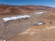The Apple Reno Data Center with its solar panel installation in the background that is located  in the Tahoe Reno Industrial Center (TRIC) east of Sparks, NV. 
Apple operates one of its major data center campuses there. Opened in 2012, the facility supports services such as iCloud and other online infrastructure. The site was strategically chosen for Nevada’s dry climate, which allows the servers to be cooled efficiently using outside air for much of the year. Apple has also invested heavily in renewable energy projects in the region, including large solar installations that help power the campus. 
TRIC has become an important part of Northern Nevada’s growing role as a major technology and AI infrastructure hub in the western United States.