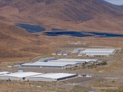 The Apple Reno Data Center with its solar panel installation in the background that is located  in the Tahoe Reno Industrial Center (TRIC) east of Sparks, NV. 
Apple operates one of its major data center campuses there. Opened in 2012, the facility supports services such as iCloud and other online infrastructure. The site was strategically chosen for Nevada’s dry climate, which allows the servers to be cooled efficiently using outside air for much of the year. Apple has also invested heavily in renewable energy projects in the region, including large solar installations that help power the campus. 
TRIC has become an important part of Northern Nevada’s growing role as a major technology and AI infrastructure hub in the western United States.