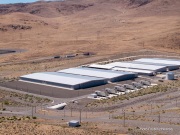 The Apple Reno Data Center in the Tahoe Reno Industrial Center (TRIC) east of Sparks, NV. 
Apple operates one of its major data center campuses there. Opened in 2012, the facility supports services such as iCloud and other online infrastructure. The site was strategically chosen for Nevada’s dry climate, which allows the servers to be cooled efficiently using outside air for much of the year. Apple has also invested heavily in renewable energy projects in the region, including large solar installations that help power the campus. 
TRIC has become an important part of Northern Nevada’s growing role as a major technology and AI infrastructure hub in the western United States.