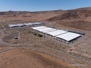 The Apple Reno Data Center in the Tahoe Reno Industrial Center (TRIC) east of Sparks, NV. 
Apple operates one of its major data center campuses there. Opened in 2012, the facility supports services such as iCloud and other online infrastructure. The site was strategically chosen for Nevada’s dry climate, which allows the servers to be cooled efficiently using outside air for much of the year. Apple has also invested heavily in renewable energy projects in the region, including large solar installations that help power the campus. 
TRIC has become an important part of Northern Nevada’s growing role as a major technology and AI infrastructure hub in the western United States.