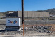 The Google data center campus at the Tahoe Reno Industrial Center (TRIC)  east of Sparks, NV. It  is part of the massive expansion of hyperscale cloud infrastructure transforming northern Nevada into a major digital hub. Located east of Reno and Sparks along USA Parkway, the facility supports Google’s growing demand for cloud computing, AI processing, and data storage services. The region’s combination of abundant land, relatively low energy costs, tax incentives, and fast network connectivity to the Bay Area has attracted some of the world’s largest technology companies. Google’s presence at TRIC reflects the increasing concentration of large scale data infrastructure in Nevada, where warehouse sized server buildings, substations, and power generation facilities are reshaping the desert landscape to support the global digital economy.