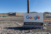 The Google data center campus at the Tahoe Reno Industrial Center (TRIC)  east of Sparks, NV. It  is part of the massive expansion of hyperscale cloud infrastructure transforming northern Nevada into a major digital hub. Located east of Reno and Sparks along USA Parkway, the facility supports Google’s growing demand for cloud computing, AI processing, and data storage services. The region’s combination of abundant land, relatively low energy costs, tax incentives, and fast network connectivity to the Bay Area has attracted some of the world’s largest technology companies. Google’s presence at TRIC reflects the increasing concentration of large scale data infrastructure in Nevada, where warehouse sized server buildings, substations, and power generation facilities are reshaping the desert landscape to support the global digital economy.