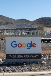 The Google data center campus at the Tahoe Reno Industrial Center (TRIC)  east of Sparks, NV. It  is part of the massive expansion of hyperscale cloud infrastructure transforming northern Nevada into a major digital hub. Located east of Reno and Sparks along USA Parkway, the facility supports Google’s growing demand for cloud computing, AI processing, and data storage services. The region’s combination of abundant land, relatively low energy costs, tax incentives, and fast network connectivity to the Bay Area has attracted some of the world’s largest technology companies. Google’s presence at TRIC reflects the increasing concentration of large scale data infrastructure in Nevada, where warehouse sized server buildings, substations, and power generation facilities are reshaping the desert landscape to support the global digital economy.