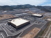 The Google data center campus at the Tahoe Reno Industrial Center (TRIC) east of Sparks, NV. It  is part of the massive expansion of hyperscale cloud infrastructure transforming northern Nevada into a major digital hub. Located east of Reno and Sparks along USA Parkway, the facility supports Google’s growing demand for cloud computing, AI processing, and data storage services. The region’s combination of abundant land, relatively low energy costs, tax incentives, and fast network connectivity to the Bay Area has attracted some of the world’s largest technology companies. Google’s presence at TRIC reflects the increasing concentration of large scale data infrastructure in Nevada, where warehouse sized server buildings, substations, and power generation facilities are reshaping the desert landscape to support the global digital economy.