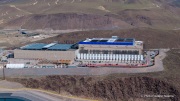 The Vantage Data Centers campus in the Tahoe Reno Industrial Center (TRIC) east of Sparks, NV, is part of the rapidly expanding hyperscale infrastructure landscape in northern Nevada, supporting large scale cloud computing and AI workloads. Like many facilities in the region, it relies on highly engineered cooling systems designed for the desert environment, combining efficient air handling with evaporative processes where water plays a measurable role in thermal management. Nearby, retention ponds and engineered water basins associated with industrial and infrastructure development in the area also reflect how water is stored, managed, and reused across large scale facilities in TRIC. The campus benefits from Nevada’s low power costs, abundant land, and strong fiber connectivity to West Coast markets, positioning it as a key node in the growing ecosystem of hyperscale data centers around Reno and Sparks.