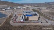 The Vantage Data Centers campus in the Tahoe Reno Industrial Center (TRIC) east of Sparks, NV, is part of the rapidly expanding hyperscale infrastructure landscape in northern Nevada, supporting large scale cloud computing and AI workloads. Like many facilities in the region, it relies on highly engineered cooling systems designed for the desert environment, combining efficient air handling with evaporative processes where water plays a measurable role in thermal management. Nearby, retention ponds and engineered water basins associated with industrial and infrastructure development in the area also reflect how water is stored, managed, and reused across large scale facilities in TRIC. The campus benefits from Nevada’s low power costs, abundant land, and strong fiber connectivity to West Coast markets, positioning it as a key node in the growing ecosystem of hyperscale data centers around Reno and Sparks.
