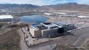 The Vantage Data Centers campus in the Tahoe Reno Industrial Center (TRIC) east of Sparks, NV, is part of the rapidly expanding hyperscale infrastructure landscape in northern Nevada, supporting large scale cloud computing and AI workloads. Like many facilities in the region, it relies on highly engineered cooling systems designed for the desert environment, combining efficient air handling with evaporative processes where water plays a measurable role in thermal management. Nearby, retention ponds and engineered water basins associated with industrial and infrastructure development in the area also reflect how water is stored, managed, and reused across large scale facilities in TRIC. The campus benefits from Nevada’s low power costs, abundant land, and strong fiber connectivity to West Coast markets, positioning it as a key node in the growing ecosystem of hyperscale data centers around Reno and Sparks.