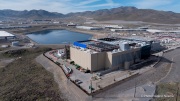 The Vantage Data Centers campus in the Tahoe Reno Industrial Center (TRIC) east of Sparks, NV, is part of the rapidly expanding hyperscale infrastructure landscape in northern Nevada, supporting large scale cloud computing and AI workloads. Like many facilities in the region, it relies on highly engineered cooling systems designed for the desert environment, combining efficient air handling with evaporative processes where water plays a measurable role in thermal management. Nearby, retention ponds and engineered water basins associated with industrial and infrastructure development in the area also reflect how water is stored, managed, and reused across large scale facilities in TRIC. The campus benefits from Nevada’s low power costs, abundant land, and strong fiber connectivity to West Coast markets, positioning it as a key node in the growing ecosystem of hyperscale data centers around Reno and Sparks.