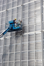 Technicians working on an Amonix 7700 Solar Power Generator or High Concentration Photovoltaic (HCPV) System at  University Nevada Las Vegas Center For Energy Research in Las Vegas, NV.