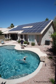 Len Gutman watches his son Connor swim at their house in Phoenix, AZ, on May 22, 2010.