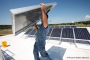 Installation of solar panels on top of Morrissey Engineering’s headquarters in Omaha.
