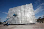 Technicians working on an Amonix 7700 Solar Power Generator or High Concentration Photovoltaic (HCPV) System at  University Nevada Las Vegas Center For Energy Research in Las Vegas, NV.