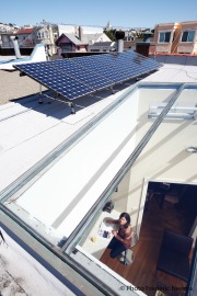 Solar panel and Elizabeth Goldbaum in her kitchen in San Francisco, CA, on September 30, 2009.