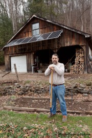 Bill Howley in front of his shed with solar panels in Chloe